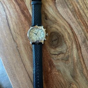 Stauer stainless steel guitar watch.